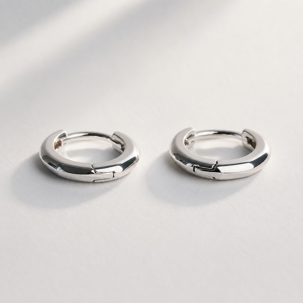 Berlo Heritage — 925 Silver Rhodium Geometric Huggie Earrings